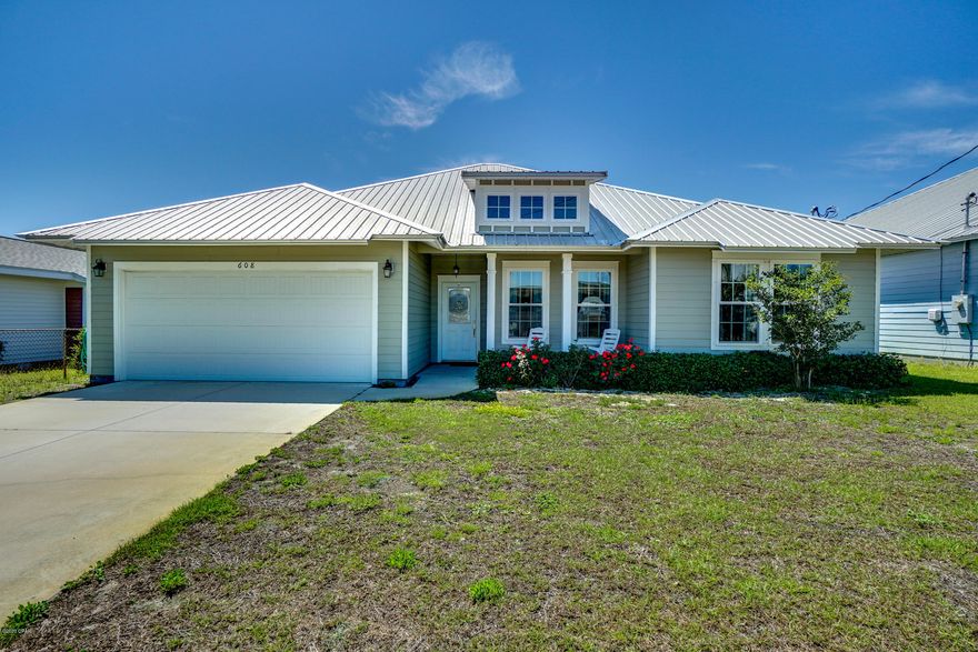 Like new craftsman-style home less than 600 feet to the beach. Home has upgrades throughout and is in immaculate condition. Granite countertops, upgraded stainless steel appliances, lighting and hardware. Trey ceilings in living area and master bedroom, arched entryways and modern wood-look tile in main living areas. Both Master and guest bathrooms feature double vanities. Covered patio looks over the back yard that has room for a pool. Take the virtual tour, then contact your agent to view this home. All dimensions are approximate buyer to verify important information. No HOA and Short Term Rentals are permitted.