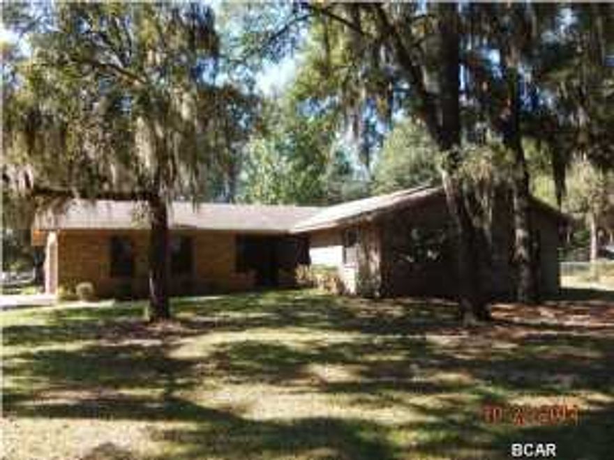 JUST REDUCED $20K!! Spacious all brick home in Bayou George area just steps from Deerpoint Lake public boat launch. This home needs a little updating, but has a nice cozy den that has wood paneling walls, wood-beamed ceiling, a fireplace, and is adjacent to the eat-in kitchen, which has all appliances. The master bath has a vanity separated from the toilet and shower area and a nice-sized walk-in closet. There is also an indoor laundry for your convenience. Property being sold As Is. All measurments approximate, please verify if important.