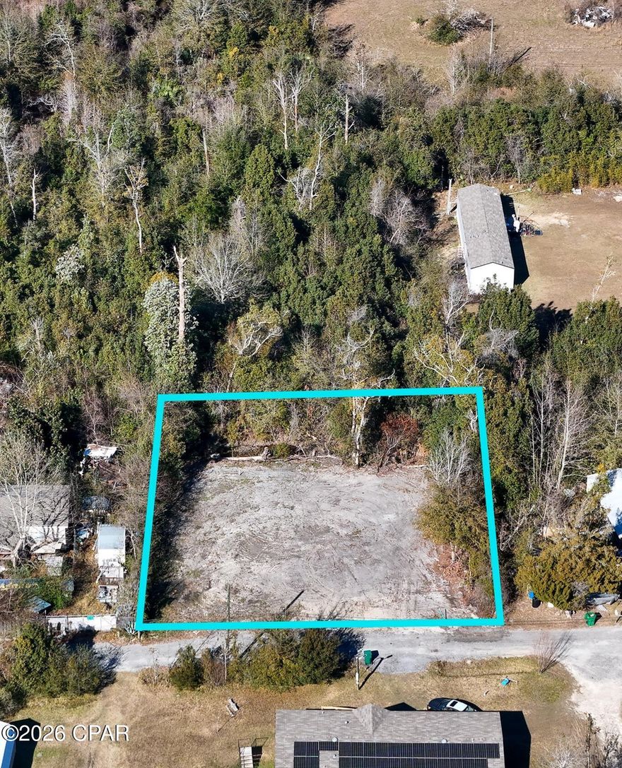 This residential lot is zoned for mobile homes or single family homes. The lot has been cleared and is ready for construction. The well has been established and has a pipe in the ground, just needs power and a pump. The city has run a sewer line to the property and its ready to be hooked into.