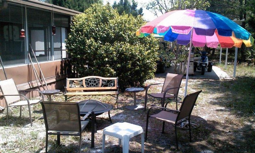 This large lot ready for your pool, family and pets. Single wide mobile home has recently been updated with paint and new laminate flooring. Bathrooms have been updated with large tub and tile. Needs to be seen to be appreciated. Yard is completely fenced with gates for your boat and toys. Screened in porch for the cool bug free evenings.