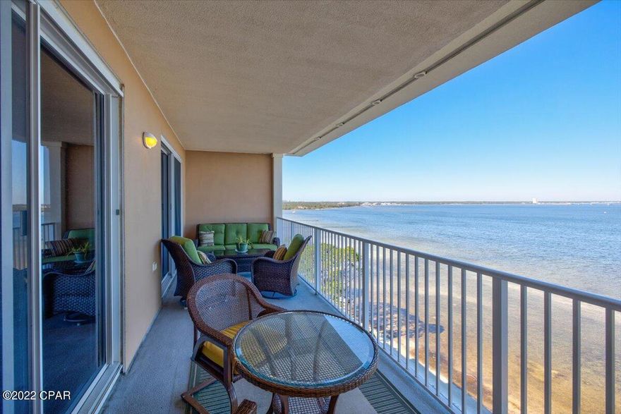 Welcome to Magnolia Bay Club, a waterfront gated community. This highly sought-after top floor unit features 3BR/3BA and offers a spectacular unobstructed view of the bay. When you enter the unit, you will notice the beautiful tile flooring and a hallway leading to the kitchen, living room and master bed/bath. The kitchen is open to the living room and dining room and features wood cabinets, granite countertops, stainless steel appliances and extra storage/cabinetry under the breakfast bar. The cozy living room has a beautiful backdrop of the bay and a glass sliding door leading to the balcony. Next you will find the master bedroom which features French doors at the entry, a stunning view of the bay and a glass slider leading to the balcony. As you head towards the master bathroom you... will notice a large walk-in closet and the bathroom 
that showcases wood cabinets, a double vanity, jacuzzi soaking tub with tile accents on the wall and a separate shower. There is also a toilet room and linen closet. As you head back towards the front of the unit you will find a full spare bathroom in the hall.  The spare bath features a wood vanity and a beautiful tile walk-in shower. As you continue down the hall you will find the second spare bedroom with a large closet and tub/shower combo. The third bedroom would be perfect for bunks or an office. The room also features a large walk-in closet for storage. Magnolia Bay Club is a quiet gated waterfront community tucked away on the east end of Panama City Beach. You will enjoy this peaceful community that does not allow short term rentals (6 months+ only). All sizes, ages are approximate, please measure and/or verify if important.