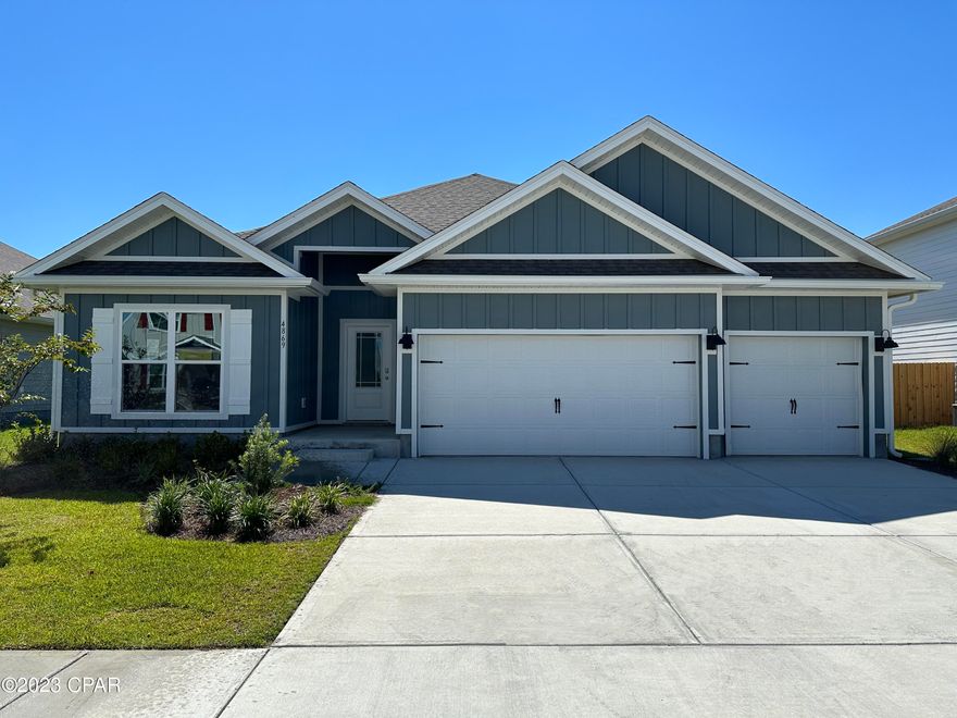 The Destin is a single story detached home that is in the highly desirable community of Titus Park. Located on the north east side of Panama City, Titus Park is a short drive to downtown Panama City, the Gulf of Mexico with sugar sand beaches, Tyndall Air Force Base, shopping, dining, and more! The home has a private entrance with concrete pathway, steps, and designer landscaping. Inside, you are warmly greeted by engineered vinyl plank floors that lead to a bright and open floor plan seamlessly connecting the kitchen to the living room and leading to the inviting, sunny backyard. Meticulous attention to detail is presented in the kitchen with granite countertops, white cabinetry with brushed nickel knobs, and stainless steel Whirlpool appliances which includes the following: stove, dishwasher, and microwave. A 10' tray ceiling with beautiful crown molding gives the living area have a very open feel. The 1st bedroom is located directly off of the living area and also features a tray ceiling with crown molding, and a bathroom featuring a double vanity, large shower, full size soaking tub, and a walk in closet. There are 3 additional bedrooms located adjacent to 2 other full bathrooms. The back patio is a wonderful entertainment space for family and friends. There is more than ample storage available in the 3 car garage. New homes in Titus Park also feature a smart home system that includes a KiwkSet Keyless Entry, Skybell doorbell, automated front porch lighting, an Echo Dot, and a Qolsys touch pad, and customizable LED lighting. Our model home is open Monday through Saturday 10-5PM and Sunday 1-5PM.