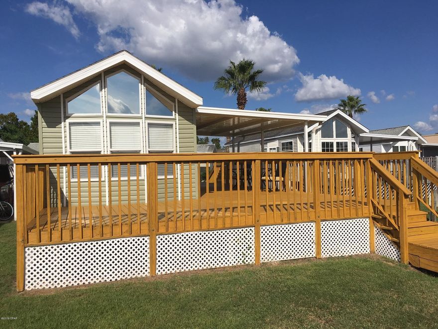 NOW BACK ON THE MARKET AT REDUCED PRICE -- ACT NOW!!!  Check out this very cute 1 bedroom 1 bath vacation unit located in popular Emerald Pointe Resort.  This move in ready unit offers a new roof, siding, awning, freshly painted interior, new flooring, fixtures and more.  Relax on wrap around deck overlooking the private pond and boardwalk.  Gated community offers a club house with full kitchen, exercise room, property management staff, pool and hot tub plus a secondary pool on the backside of the subdivision, walking distance to unit. HOA fees include lawn, garbage, water, sewer and cable fees at a very reasonable quarterly cost. Minutes to the gulf coast and all Panama City Beach has to offer. Call for an appointment to see today.