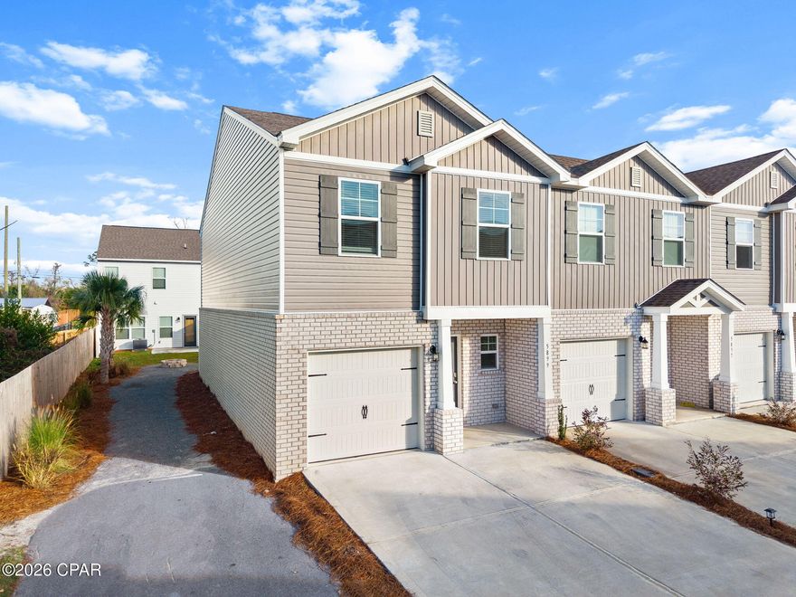 Welcome to 5899 Tyndall Place. This charming end-unit townhome offers 3 bedrooms, 2.5 baths, and a private one-car garage. LVP flooring runs throughout the entire home, giving it a clean, modern feel with easy maintenance. Designed with simple lines and thoughtful details, this home is both comfortable and functional. It's conveniently located just minutes from Panama City's white sandy beaches, shopping, dining, and local attractions, and within a short drive to Tyndall Air Force Base, making it ideal for work-life balance.  Whether you're a first-time homebuyer or an investor, you'll appreciate the peace of mind that comes with owning a new home. The surrounding area continues to grow, with new development and community improvements adding long-term value.  Enjoy nearby parks, everyday conveniences, and an easy commute, all while living in a stylish and well-located home. Don't miss the opportunity to make this one yours. Contact your Realtor today to schedule a private showing.