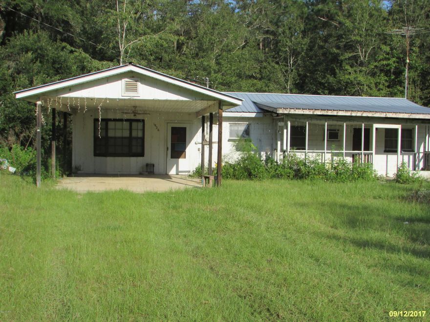 NEW ON MARKET.  2 Bedroom 1 Bath with 1034 sq ft. Located on 2 acres. Living room plus family room! 1 Car carport, metal roof. Very quiet street and the best of country living. Call today for more information.