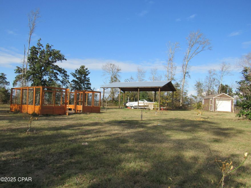 BACK ON THE MARKET DUE TO NO FAULT OF THE SELLERS! Gorgeous, manicured, and completely fenced over 3 acres! This property offers peace and privacy as it is bordered on two sides by the McCall sod farm! There are fruit trees, magnolias, sweet gum, and bay trees! This property boasts a 24x36 pole barn, a 8x12 utility shed that has washer/dryer hookups, and an enclosed garage. There is a beautiful walk-in garden that is enclosed, with raised beds! Water and electricity already in place! 2 RV connections available that offer both 30amp and 50amp! What more could you dream for?! This property is just waiting for you to build your dream home! Don't miss out, call to schedule an appointment today! Please verify all measurements and information.