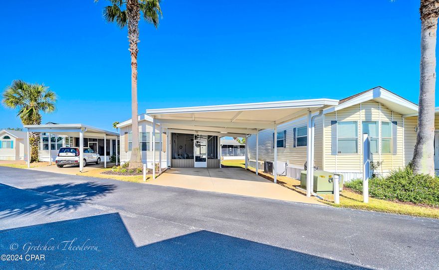 Welcome to your dream beach property! Whether you are in the market for a full-time residence, 2nd home, or investment property, this one is a must see! This beautifully updated home is waiting for you in the highly sought after Emerald Pointe Resort. This meticulously maintained beach home features a bright open floorplan with one bedroom, 1 enlarged bathroom with tile and full-size shower, an extra-large screened in porch with three ceiling fans, utility room w/full size washer/dryer and two levels of shelving for added storage, 6' standard ''Anderson'' glass door, Pergo laminate floors inside, extra closet in bedroom, metal roof over 30'' bathroom add on & utility room, and a 2-car attached carport with solar lighting. Recent updates include: Roof and HVAC 2022, Hot Water Heater 2021, Stove, Microwave, Washer, Dryer and sink 2017. Emerald Pointe Resort is a golf cart friendly, gated community located in the heart of Panama City Beach close to restaurants, shopping, and the world's most beautiful beaches. Amenities include a large clubhouse, exercise room, 2 pools (one heated seasonally), hot tub, lake with boardwalk, and shuffleboard court. HOA fee includes water, sewer, garbage, cable, and lawn service. All information is approximate and should be verified by buyer if important.