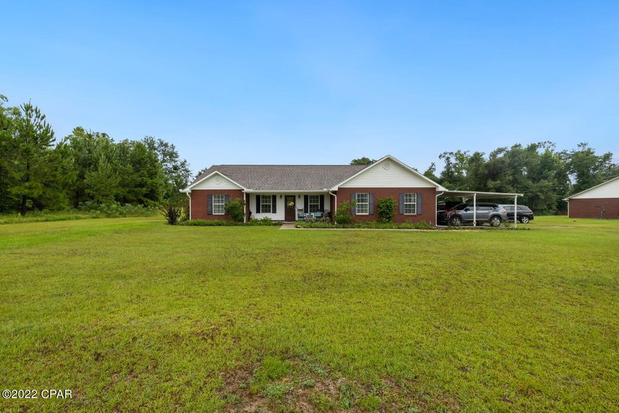 CURRENTLY UNDER CONTRACT, SELLER ACCEPTING BACKUP OFFER. The perfect combination of country and coastal living in the gorgeous, updated, brick home on 1.09 acres of land.  If you have been looking for a large, updated home, this home is for you. From the time you enter you can feel the space this home has. The Kitchen includes stainless steel appliances, dark wood custom cabinets, a breakfast bar, and opens to the 22.4x15.6 spacious living room, as well as the 8.1x 9.5 dining area. The master bedroom sits to the right of the home and is large enough to host your oversized furniture, or even enough room for a sitting or desk area. The master bath has a large walk-in closet, double vanity sink, separate water closet, a jacuzzi tub, and a separate shower.  Also, on the right side of the home is the 22.1x21x4 Bonus room featuring a separate entrance and a closet. The sellers currently have this room setup as an entertaining-game room, but it could also be used as a 5th bedroom if needed.  The other two bedrooms and full bath are to the left of the home.  The sellers completely enclosed the porch, added a closet, created a separate entrance, to create bedroom #4.  If you are looking for a large home to host your whole family, this home has all the room you will need.  There is also a separate laundry room with wash basin, and cabinets for additional storage.  One of the wonderful things about this home is its all tile, luxury vinyl plank, or NACO wood flooring for easy maintenance.   If you like to entertain, this is the home for you.  Not only is it spacious, but the backyard is completely fenced in, has a brick paver patio and lounging area, separate outside storage with a covered area to store your lawnmower and other outside tools, and the seller is leaving the playground/swing set.   There is so much more I could say about this home, but you must view it to appreciate the space, updates, and extras.  Additional Features Include: Security system, roof replaced 2018, carport, plenty of storage, updated lighting, and so much more. Cottondale is located in the Florida Panhandle where we have the best rural communities, colleges, hospitals, and the worlds most famous beautiful beaches.  Is this sounds like the home you have been looking for contact your realtor today for a private showing before your dream of owning a piece of paradise becomes someone else's reality!  Age, Sq.Ft., School systems, room dimensions, taxes, or any important information is an estimate only and must be verified by the buyer if important.