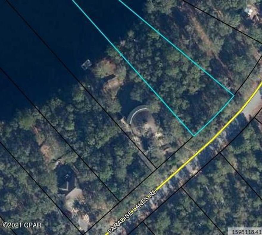 Here is CURRENTLY UNDER CONTRACT SELLER ACCEPTING BACKUP OFFERSa chance to own a pretty waterfront lot in Paradise Lakes, a gated subdivision north of Lynn Haven. There are new signs of development as new housing is under way in this quiet subdivision. This lot is on Paradise Lakes Road and would make a wonderful home site with a killer water view across the lake. It would make for some nice sunsets. The lake water is clean and there are many cypress trees in view. Build a dock and bring your boat!
