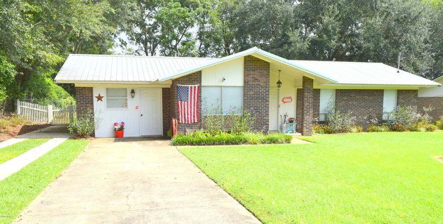 This beautiful 3-bedroom, 1.5 bath home is move-in ready and would make a great first-time home or investment opportunity! Inside you will find many recent updates including kitchen cabinets, countertops and appliances, detailed molding, recessed lighting, tiled floor throughout, tankless hot water heater and bonus room that could be converted to a 4th bedroom. Relax and unwind outside on the spacious covered rear patio enjoying views of the freshly landscaped yard with irrigation. Property is located in a quiet neighborhood in the city limits of Graceville, walking distance to the Baptist College of Florida.