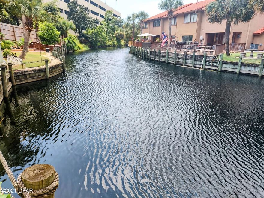 This is that BEACHY Unit ON THE CANAL you have been waiting for. This is a Must See 2 BR with 2.5 Baths, each Bedroom has its own Private Bath. Come sit on the HUGE Deck and enjoy Grilling Out or Fishing or Sun Bathing. New... Water Heater, Blown Insulation in attic, Kitchen Cabinet Facings & Hardware, BR Furniture. Gulf Highlands Beach Resort is a Gated Community with 11 Pools, 4 Tennis Courts, 18 hole Mini Golf, and a Club House with Snack Bar & a Pool that are Gulf Front!!! Park in front of your unit, no elevators. Age, SF, and Dimensions are approximate... please verify if Important.