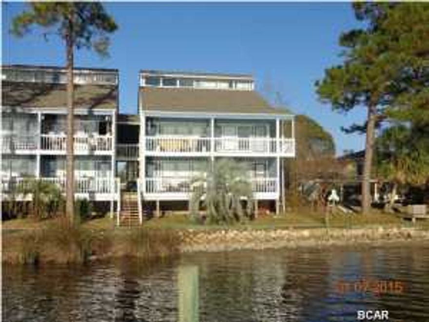 Looking for a great deal? This may be it! 1 bedroom, 1 bath condo with a 13X14 loft and large attic space for storage. Imagine sitting on your front covered porch 8x18.6' watching the boats go up and down Grand Lagoon-this waterfront condo is a bargain at $70,000. This is a small complex complete with a large dock to fish off of or tie your boat up to one of the slips as well as a sparkling pool. This unit needs lots of TLC, but priced with that in mind. There was a water leak in the kitchen but now repaired. Multiple offers received, Seller will be calling for highest & best offer at noon Feb. 25-get your offer in now All sizes & age are approximate and should be verified if important. Being sold ''AS IS''.