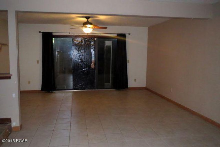 ATTRACTIVE AND SPACIOUS TWO-STORY TOWNHOME and just steps to Tyndall AFB!

This unit features a large living/dining area, full kitchen and half bath on the first floor with a glass-sliding door to a small patio.  The second floor has a Master bedroom with a balcony and two additional bedrooms.  The home also has a one-car attached garage.  This community enjoys their own private beach access to East Bay!  It needs some TLC, but it has great potential!  Home is being sold in its AS IS condition.