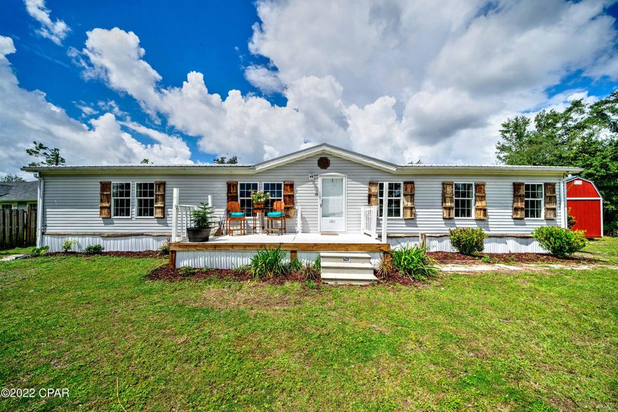 Looking for a quaint escape & yet still be close to the city!? This may be the property for YOU! This home comes with NEW FLOORING, NEW PAINT, A NEW BACK PORCH, and sits on almost a full acre! There's plenty of room for a garden or pole barn! The possibilities are endless, so call your favorite Realtor today to view!