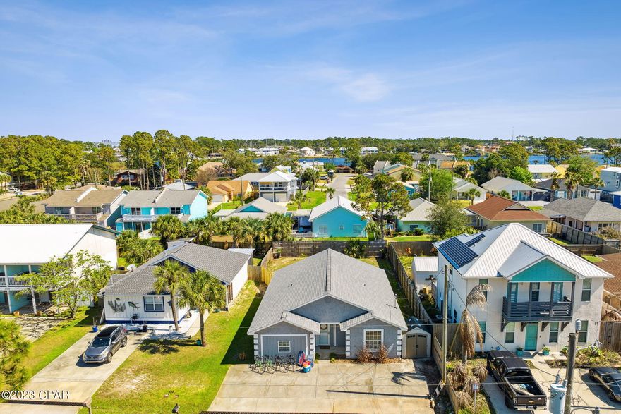 Turnkey property that has proof of a rental machine. Recently underwent major renovations and is practically brand new! PROPERTY HAS GROSSED 30K IN JUST 4 SHORT MONTHS! This 3-bedroom 2 bath beach oasis is centered in the heart of PCB off Thomas Drive. Home sits on a large lot that is fully fenced and set up with two hammocks, ladder all, cornhole, firepit and newly completed deck and 10 ft tank pool. Tucked away on a quiet street in a family neighborhood on the East end.  Quick 8 minute stroll to the beach. Furnishings negotiable.