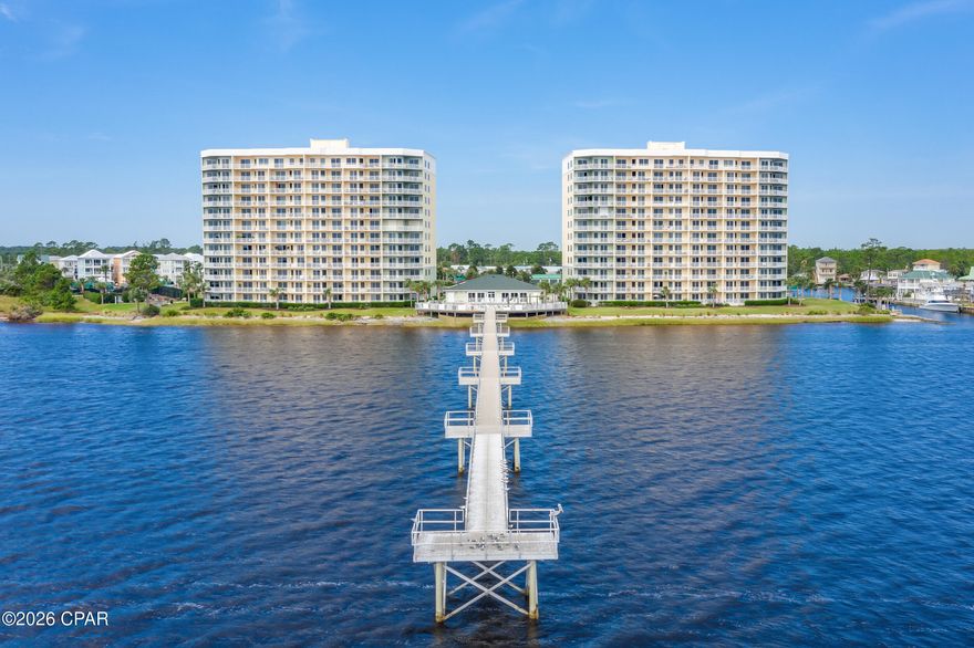 The BEST in Waterfront Living: This beautiful community includes boat slips and garages for sale or rent, jet ski slips, over 400' fishing pier, grilling stations, tennis basketball or pickleball court, fire pit, and a walkway/stairs into the gulf for your paddle board or kayak, plus much more! Step inside this amazing condo and you will immediately notice the over $70K in upgrades: extra security French doors in the foyer for safety also to ensure a pet  won't dart out; Remote controlled hurricane shutters on the water side; custom made room darkening shade; insulated draperies, plantation shutters; Custom 3/4'' all wood shaker cabinets in kitchen with quartz countertops- including slide-out shelves in all bases; Stainless steel appliances with electric cooktop and built-in oven & microwave; built in 3 door refrigerator; dishwasher with 3 sliding shelves; Farmhouse double sink; Pendant lights; Newer HVAC with hepa filter & heat pump with networked programmable thermostat; Water heater replaced; Custom trim and wainscoting; Whole house surge protector and Water filter; Stackable Washer/Dryer, pantry and storage area in kitchen area.  The large primary bedroom features trey ceiling; new sliders with a spectacular view of the sunrise on the bay and ensuite with double vanities and quartz counter tops; separate venetian marble shower; garden tub with tile surround and spacious closet with built-ins. The Great Room features the new hurricane rated sliders with another fabulous view of the bay. The secondary bedroom features a spacious closet; plantation shutters and a full bath with large shower just steps away! This amazing home also features LVP flooring throughout; and fresh, custom paint. The community completed the Structural Integrity Study and invested millions in improvements with no extra costs to the residents. The buildings have been completely resurfaced and repainted including the walk ways. The amenities also include a work out gym, community room for parties/get togethers, and a peaceful library for working or reading at no extra cost to residents.  The no short term rentals make this community a more relaxed/serene lifestyle with an atmosphere of unity and long term friendships. The HOA includes water, garbage, pest control, high speed internet with over 200+ tv channels, gated entrance and cameras for security.  If the amenities and welcoming atmosphere don't draw you in - the awesome sunrises and water life will - including dolphin, redfish and mullet.  It is truly an exceptional place to live!