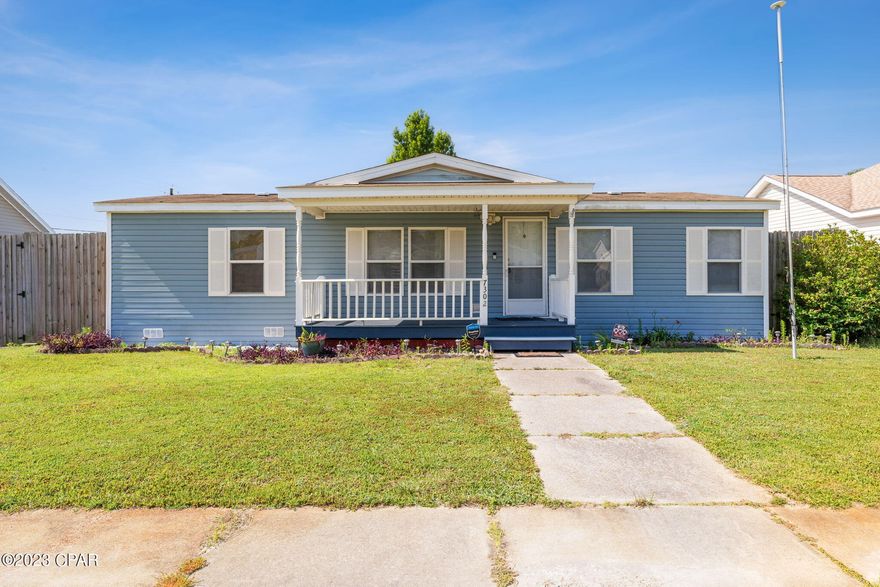 Don't miss this 3 bedroom 2 bath doublewide mobile home in a nice neighborhood in Callaway.  It is ready for your updates to make this your new home.  This split plan home has a spacious living area that overlooks the dining area.  The kitchen has lots of cabinets and a pantry for additional storage.  There is newer laminate flooring throughout these areas.  The laundry is located at the end of the kitchen.  A washer and dryer are being left with the home. The refrigerator, dishwasher and oven are all in great condition.  There is a countertop microwave that will stay with the home.  The master bedroom is carpeted and has a walk in closet.  The master bath has a walk in shower, garden tub and double vanity sinks.  On the other side of the home there are two carpeted guest bedrooms and a guest bathroom with a tub/shower and single vanity.  The outdoor spaces are what make this property so unique!  You'll enjoy the large covered front porch, then in the backyard there is an 8' privacy fence and a poured concrete drive that leads to a double carport.  There is plenty of room to park your boat or camper.  Gate only opens from inside the property.  There is a small storage building under the carport and a larger shed adjacent the driveway of the carport.  The seller also left a quonset hut storage tent that he used to store his lawn mower under.  There is also a well that is used for lawn use.  An orange tree and fig tree are also in the backyard.  The home is on public water and sewer.  The roof was replaced in 2019, water heater in 2011, A/C in 2017. The water servicing the toilets is coming from the well instead of the public water. 
 There is a flag pole in the front yard.  This quaint neighborhood has sidewalks and street lights so you can enjoy walking.  The home is conveniently located near parks, schools, restaurants, shopping and Tyndall AFB.  Survey is located in Documents. Make your appointment to see this one today!