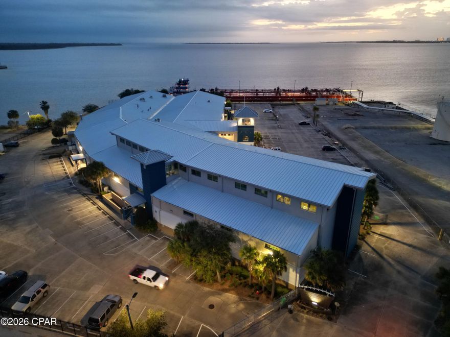 This space is clean, professional, 100% commercial grade and is perfect for R&D, Technical light mfg, and warehouse.  It has a small 10'x15' entry office.  There is a separate executive office suite directly above on 3rd floor w/ single offices up to a 22 person office/4,950 sf with water views and city views for rent separately.  2 ea 8'x10' coiling garage doors dock height; one door has load leveler; 1 ea 12'x12' garage door accessed via truck ramp.  Entire space is AC'd.  250 Amp panel 480V/277V, 3 Phase and 100 Amp single phase 120V panel.  Stainless utility sink w/hot water.  Air compressor piping system throughout.  Lockable 10'x15' cage storage area.  Stainless tables, storage totes, carts, & storage racks are potentially available for purchase from prior tenant.  Ample parking w/security fencing and automatic car and personnel gates.  Very clean space ready for immediate occupancy.  Bayside common area porch/picnic grounds.  Adjacent warehouse Suite 107 - 10,239 sf is available as is nearby Office Suite 600 -13,999 sf.