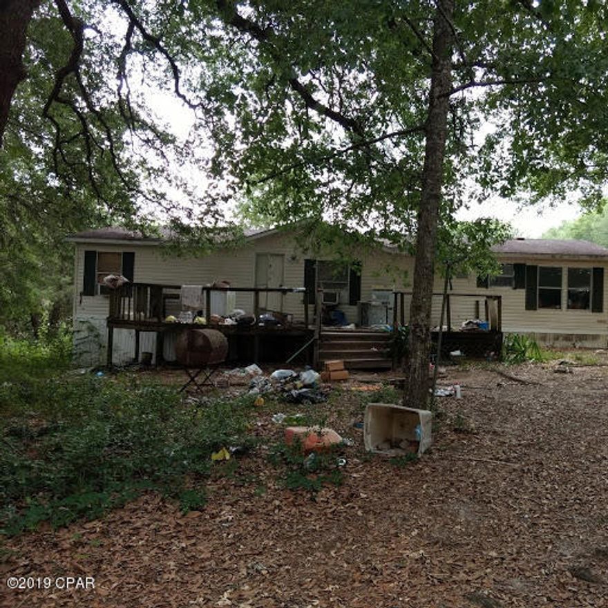 GREAT DEAL! 44 acres on JW Miller road, north of Bonifay. Lots of big oak trees for shade. Several nice home sites to choose from. There is a double wide mobile home on property that is in fair condition. Has a large pond with pretty blue water..At this price, won't last long. make an appointment to see today.