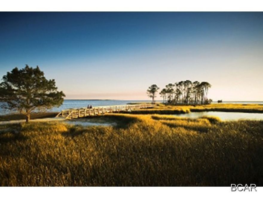 This a prime lot on Crooked Creek, in an exclusive JOE waterfront community, just 10 minutes from the beach! RiverCamps on Crooked Creek is a 1,500 acre pine forest gated community surrounded by three spectacular bodies of water, Crooked Creek, West Bay and the Intracoastal Waterway. The amenities in this community include a 25,000 square foot RiverHouse, the community activity center, encompassing of decks, boardwalks, covered pavilions, heated and cooled spaces and a 600 foot pier that extends into West Bay. The RiverHouse also includes a pool, hot tub, fitness center, library, catering kitchen, dining area and our homeowners can reserve kayaks, canoes and bikes. The community boasts an upscale boat basin with a private boat ramp for launching boats up to 27 feet. There  are approximately eight miles of scenic waterfront walking and biking nature trails.