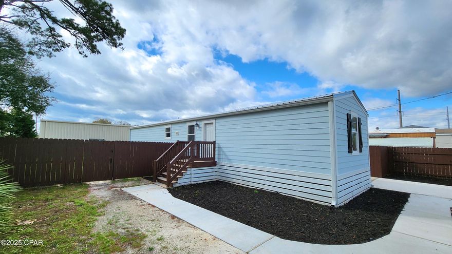 Looking for a cozy and affordable home near the beach? This updated 3-bedroom, 1-bathroom trailer home is centrally located, offering Freshly paint, modern LVP flooring. It also features a brand-new concrete driveway and a fully fenced backyard, providing privacy and plenty of space to enjoy. Tucked away in a quiet, centrally located neighborhood, it's just minutes from the beach, shopping, and dining. Whether you're looking for a cozy home or a smart investment, this gem is ready for you