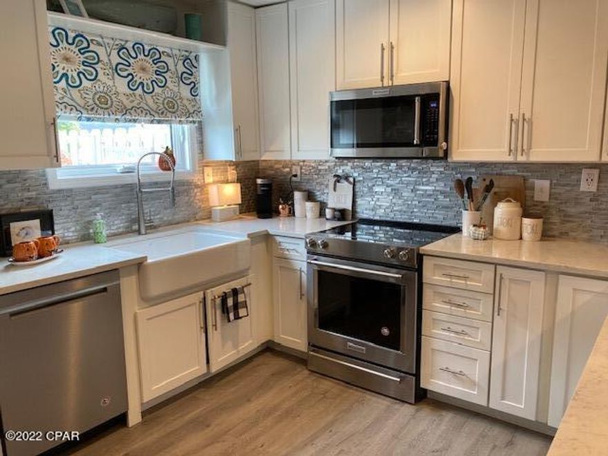 Fabulous totally renovated GROUND Floor Unit. Farm House Sink, Granite surround electric Fireplace is BEAUTIFUL. NO CARPET at all! LVP flooring! Screened Porch for those lazy afternoons. Quite Lawn area maintained beautifully by the Condo Association. This unit is getting new windows and doors too! Wonderful neighborhood and neighbors. With gated security and wonderful sidewalks to take those daily walks. Bay Point is so unique and once you live here you never want to leave! No other neighborhood like it around! You have got to see this unit before you buy anything!. I promise you will love it! NO GOLF Balls to worry about hitting the windows on units on this side. The opposite side on 18 gets golf balls so LOCATION IS IMPORTANT! Walk to Golf Club -Club 72!