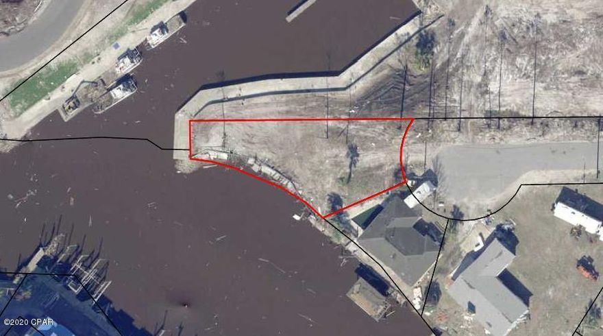 Canal front lots are hard to find! 43 feet of canal frontage, build your boat house and home on this end lot. This lot is right next to the boat ramp which provides easy access to your personal slip. It also provides easy access to the Gulf of Mexico, only having to go under the Hwy 98 Bridge. Its the boaters dream lot.