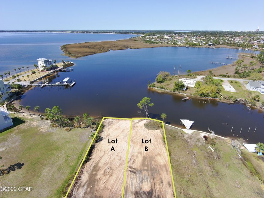 WATERFRONT PARADISE! Rare find for this westward facing 50 x 450 deep waterfront lot on Emmons Bayou right off of East Bay in Callaway with easy access to the Gulf. Amazing Sunsets every day! This land has been cleaned up and cleared and also had over 100+ loads of dirt total put on this buildable property.  There is a 30 ft easement for Lot A which gives them access to the other lot in the driveway of Lot B.  Plenty of room for home and multiple garages or pool on this property.  Next door there are Million-dollar homes in East Bay Preserve, a gated community currently with 6 built homes.  No HOA on this lot or the lot next door which is also for sale.  Located near the end of the dead-end street to allow for added peace and privacy. On a Paved road, with City water and sewer available.