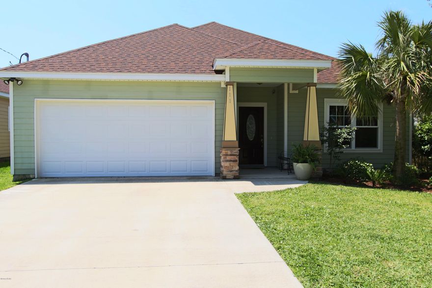 Built to suit owners that love to entertain! The first thing you will notice is the arch ornamented entry way, which leads to the open floor plan concept where the kitchen, dining and living room flows into one another. The Kitchen has granite counter tops and a spacious center isle with sink, dishwasher and high bar. The master bedroom is spacious, master bath has double vanity, separate shower, jacuzzi tub and walk-in closet. The 2 additional bedrooms share a full bath that opens into the hallway for guests. Hardwood flooring through out. Backyard is completely fenced with 8' privacy fence across the back. Open Sands is conveniently located to business and entertainment, only a 10min walk to the beach, nearby Pier Park, Frank Brown Park, Holiday golf course.