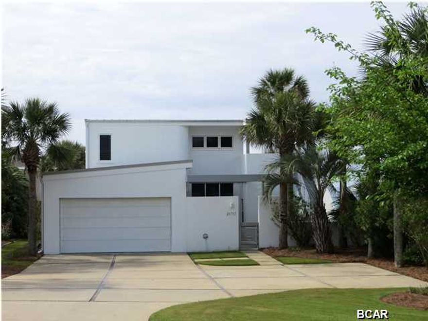 Completely remodeled 3 bedroom 2 bath gulf front home with a Californian flare. The architectural design of this home has crisp lines which gives it a real sleek appearance. The home has all of the amenities that you would expect; stainless steel appliances, granite counter tops, new carpet, recessed lighting, polished concrete flooring, over sized windows, high ceilings, full home security system, 2 car garage to hold all of your beach toys and abundant parking for your guests...This is not your typical beach house... There are 2 large balconies off of the master bedroom located on the second floor that can be accessed from the exterior of the home as well, with the kind of views that you would imagine...blue skies, surf, sand and sea oats. The home is surrounded by a manicured lawn which great concrete accents that give it a GQ look. Please come and view today.....