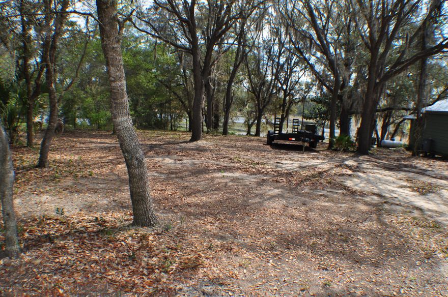 CURRENTLY UNDER CONTRACT, SELLER ACCEPTING BACKUP OFFERS.  Lake front lot near Hwy 20.  Approx 65x200 with well and septic on the property.  Great for building a home or bring in a mobile home.  All info is approx. .