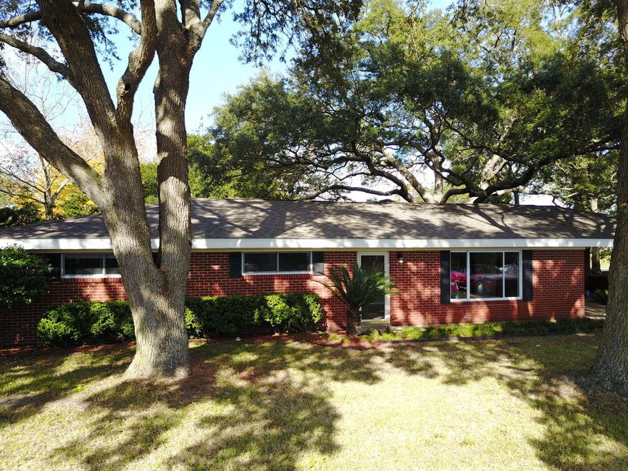 WATERFRONT UNDER 300K!!!  Bring your boat and be on the bay in less than 2 minutes. Canal home located in Panama City Beach.  Freshly remodeled and landscaped.  Boat dock with deep water canal with quick access to bay and pass.  Sailboats will not have a problem here.  All Brick construction with updated roof, tile floors, and windows.  There are several storage areas and out building for lawn and fishing gear.  Sprinkler system and well for the lawn irrigation.