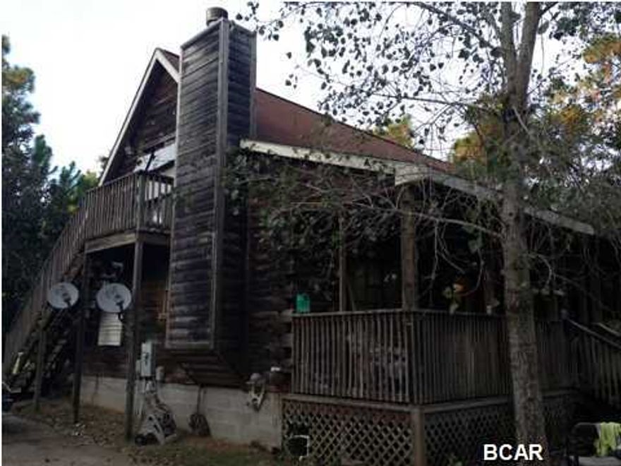 DON'T MISS THIS FABULOUS OPPORTUNITY TO OWN A GREAT LOG CABIN HOME NEAR THE BAY IN SANTA ROSA BEACH!!! THIS IS A REAL COOL TWO STORY LOG CABIN HOME WITH A FIREPLACE - THIS CAN BE QUITE THE HOME WITH A LITTLE WORK - WAIT! THERE'S MORE! THERE IS ALSO A THREE BEDROOM 2BATH MOBILE HOME ON THE PROPERTY THAT CONVEYS WITH THE SALE - THIS IS A FINE OPPORTUNITY TO LIVE IN A VERY NICE LOG CABIN HOME AND RENT THE MOBILE HOME OR RENT THEM BOTH OUT - THIS IS A MUST SEE - SO DRIVE BY AND CALL YOUR REALTOR!