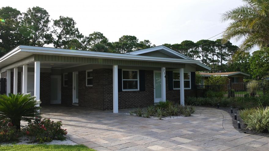 Old Florida beach house on the Lullwater Lake. Salt water pool and Hot tub, private dock, and 2 blocks from beach access. This vintage 2 bedroom/2 bath plus a spacious bonus room that can be used as a 3rd bedroom. This home  has an open floor plan, terrazzo floors ,and outdoor space that overlooks the dune lake - Feel at home inside as well as outside. This property is non-pet friendly.