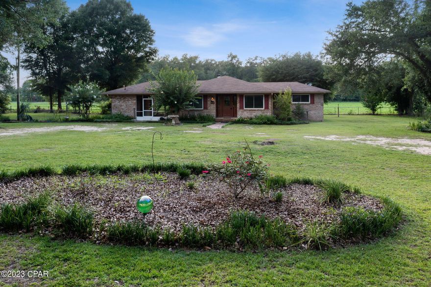 CURRENTLY UNDER CONTRACT SELLER WILL CONSIDER BACK UP OFFERS .A Little Bit Country with lots of privacy! This well maintained 3BR, 1 & 1/2 Bath, Brick Ranch has plenty to offer: The house sits towards the back of the property, which is a little shy of 1 acre, and has a large fenced backyard with an outbuilding for storage. It offers an open kitchen / dining area with a small pantry. The Kitchen door opens onto a screened breezeway leading to the laundry room and additional storage. The living room is small, but the 1st large bedroom has a bonus room that could be used for a den or office. The master bedroom has a full bath, with a walk in shower. The half bath has recently been completely redone. There is no refrigerator, and the dishwasher needs replacing. The home is furnished with Antiques, some are FOR SALE and the prices are marked on each piece. Great little house for a family, plenty of room for all.