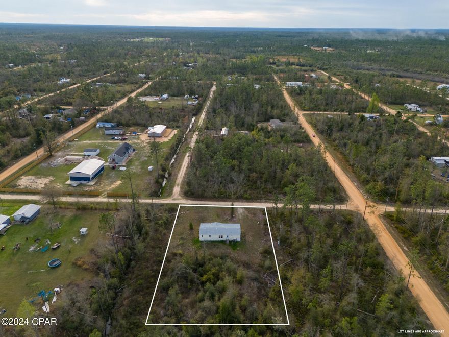 Welcome to 18006 Overland Avenue, where country living meets modern comfort and endless possibilities! This spacious double-wide manufactured home offers 4 bedrooms and 3 bathrooms, situated on an expansive 0.83-acre lot spanning across 5 lots (135x250 dimensions). With ample space, you can build your dream home, expand the current property, or simply enjoy the open land.

This home comes with a brand new roof, new HVAC system, and a new hot water heater, ensuring peace of mind for years to come. It also features a septic system. Nestled just down the street from the picturesque Econfina Creek, known for its crystal-clear waters, this location is a haven for outdoor enthusiasts. Spend your days canoeing, water tubing, or exploring the nearby natural beauty.

Zoned R-2 Limited Multi-Family, this property opens up a range of possibilities for future use. Conveniently located just 40 minutes from Northwest Florida International Beaches Airport, you'll have easy access to both rural tranquility and modern conveniences.

All measurements deemed necessary should be verified.