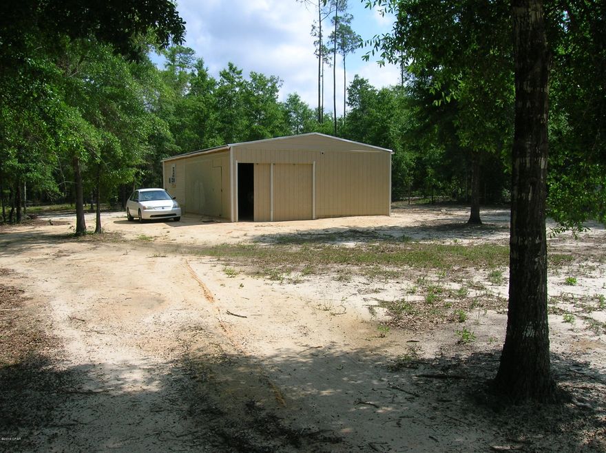 Act quickly before it is gone!

Wonderful getaway that is setup with well, septic, water heater,  enclosed pole barn, and electric; completely fenced!  Pole barn has living quarters in the back of it, complete with kitchen area, murphy bed, sofa, and bathroom with shower.  Window ac and electric heater to keep you comfortable.  Enjoy watching the squirrels and wildlife.  Copies available

of permits that were pulled and receipts from the contractors that did the work. This is a nice setup.  A place to live while building your home or move a mobile in.  Septic is large and will accomodate a three bedroom home.on a nice road just off Hwy 231, and far enough away for  peace and quiet. Room for RVs inside or out of the pole barn. Please verify all information.