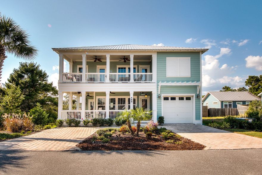 Female builders personal home. Beautifully decorated. Two master suites; First floor master. 3 decks/ 2 are covered. Elaborate summer kitchen, mature landscape. Large, private bathrooms in all bedrooms. Outdoor shower, large laundry room/mud room. Spacious closets, generous use of storage. Exotic Marble counter tops with elaborate back splash.  Large Island in kitchen. Bonus room with built in cabinets and bar. Large, private covered deck off second floor master and third bedroom. Bright home with abundant use of windows with custom blinds. Coastal trim package wraps all windows and doors. 2 x 6 construction, foam insulation. Must see!