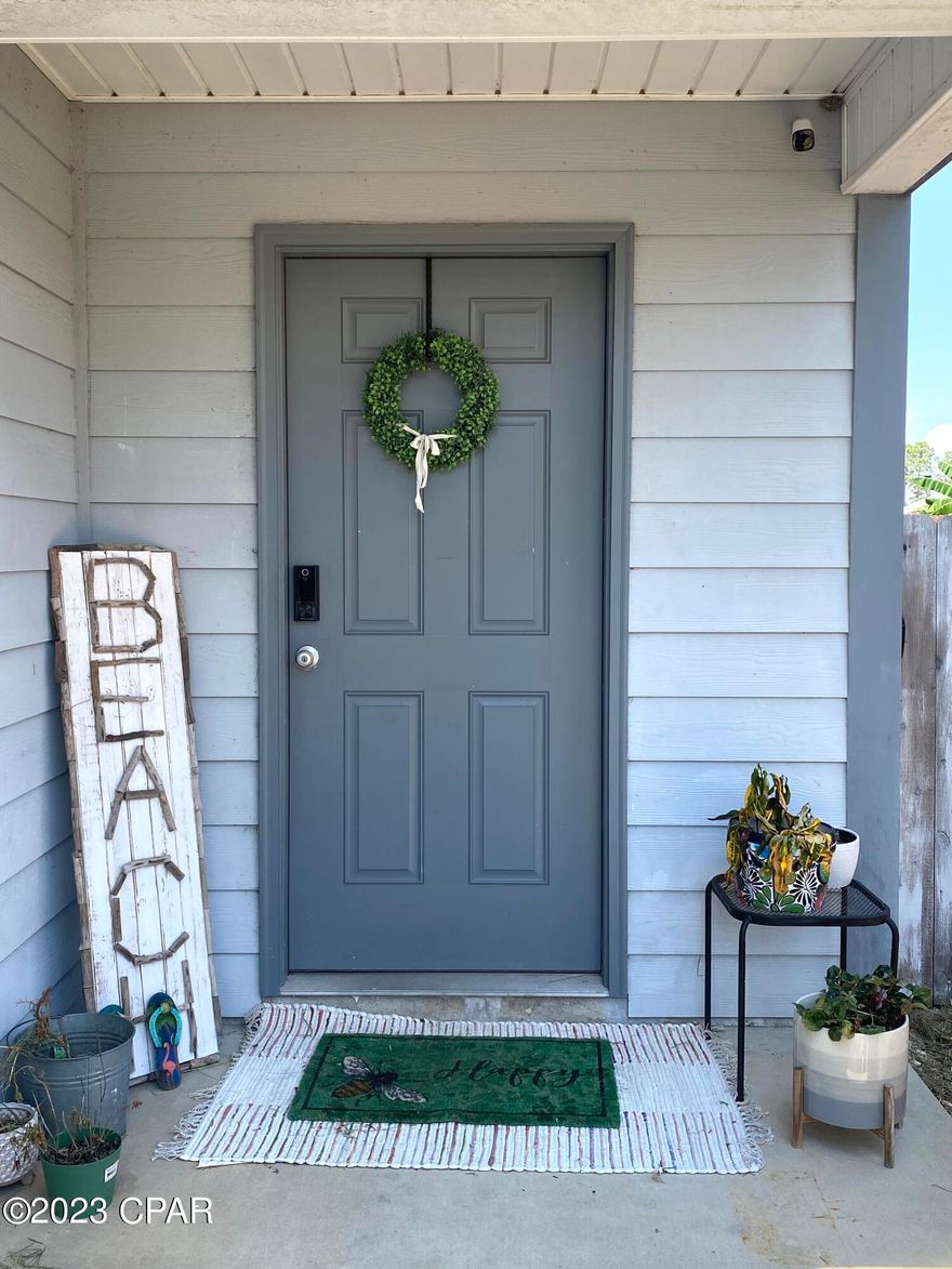 Pack your bags and move to the BEACH!! This two bedroom, 2 bath duplex is just too cute to pass up...you're not gonna wan't to miss out on this one!! Ceramic tile throughout the unit, vaulted ceiling in living area, decorative trim and white cabinets. There is a well for the irrigation and a lift station split between 4 units. This unit does have a back deck, sprinkler system and a metal roof!  This unit could be a short term or long term rental!! Very convenient location to some of the most popular restaurants on the beach, entertainment and shopping!! This cozy little beach cottage is low maintenance and is waiting for you!
