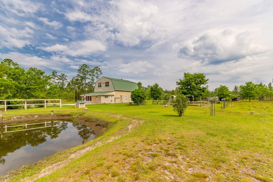 Just appraised at $232,900!  And seller is proving a home warranty.  This home is on 4.66 gorgeous acres that features a full apartment upstairs. The upstairs could be easily remodeled to make this a 5 bedroom! Each floor is approximately 1040 square feet of living space both with 2 bedrooms.  The house and property have been very well maintained.  Property features a pole barn, work shop (which used to be a horse stable), chicken coop, garden and more. Roof is 5 years old. If you're looking for country living, this is it.