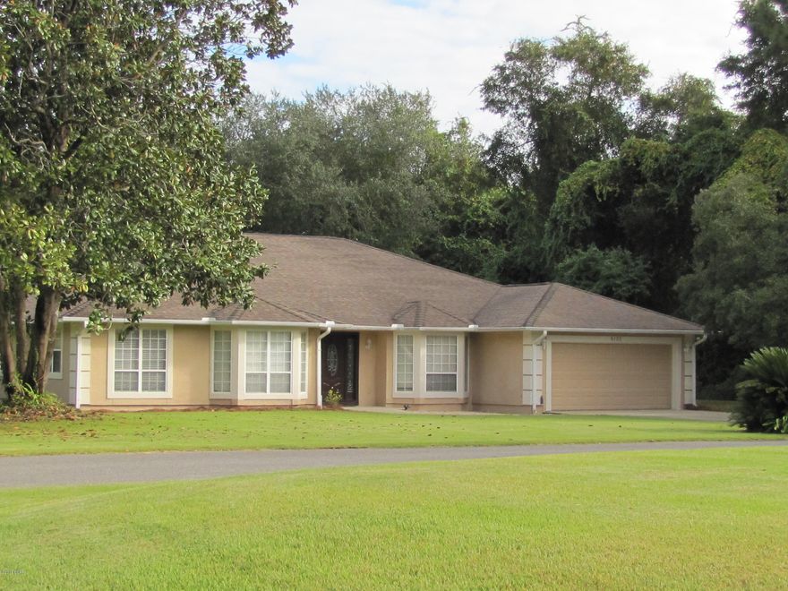 REDUCED $50,000.00 Immaculate custom built home in Deer Point  situated on a large corner fenced lot. This home features 4 bedrooms 3 bathrooms, large tiled entry, office or study, very spacious great room, formal dining room, large kitchen and breakfast nook, pantry, laundry room, screened porch and a large open deck area going to above ground pool. The 4th bedroom has it's own on suite bathroom with access to the porch by a private door. Would make a great mother-in-law quarters.

 Pictures do not do this home justice.  The tile inlays at the front door, kitchen and master bedroom are mosaic from Honduras. Some recent upgrades that have been done are; sprinkler system in front and side yards 3 years age. Hot water heater replaced 1 year ago. Both AC units were replaced 4 years ago. And the carpeting in bedrooms 3 years ago.