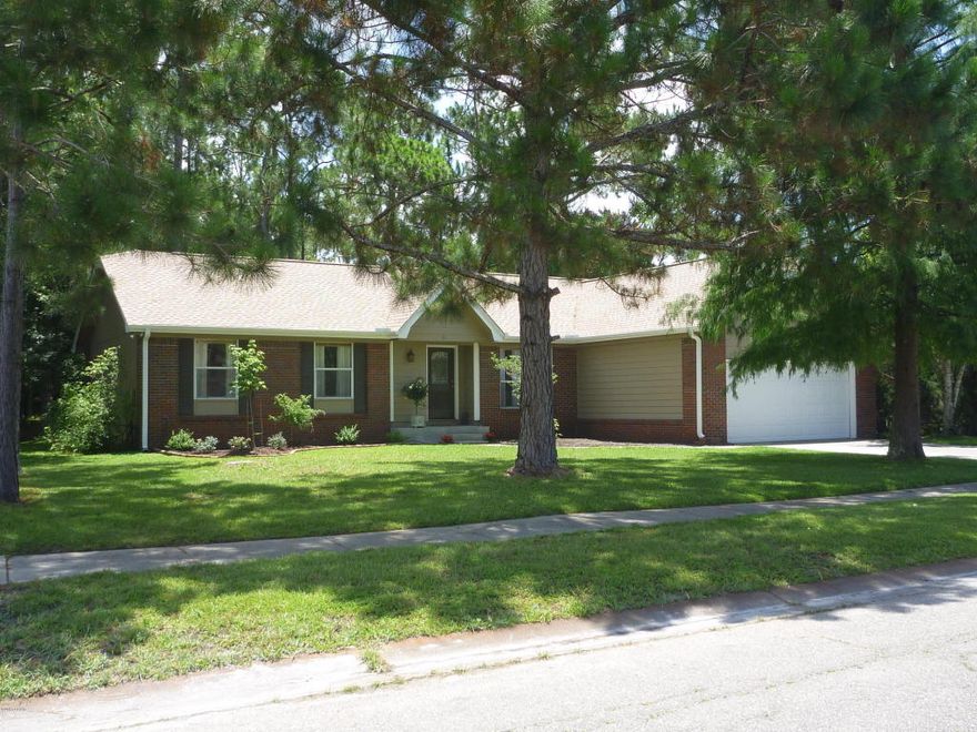 CLOSE TO TYNDALL AFB, immaculate and newly remodeled home that has never EVER flooded!! So much to offer, this home is filled with natural light that makes it bright and inviting. The catherdral ceiling adds to the openness and the 2 french doors to the deck make it bright. The french doors flank a lovely brick, wb/fp for those chilly winter nights. Stunning landscaping gives you lots to enjoy, between the water views and the wildlife in the trees behind the home. Recent renovations on this home include: All new roof!, water heater, a/c, windows, french doors, tile flooring in kit and bathrooms, disposal, granite counters, plumbing fixtures in the kit and baths, dishwasher, and light fixtures. New carpet comes with a transferable lifetime warranty against stains. The Tempurpedic