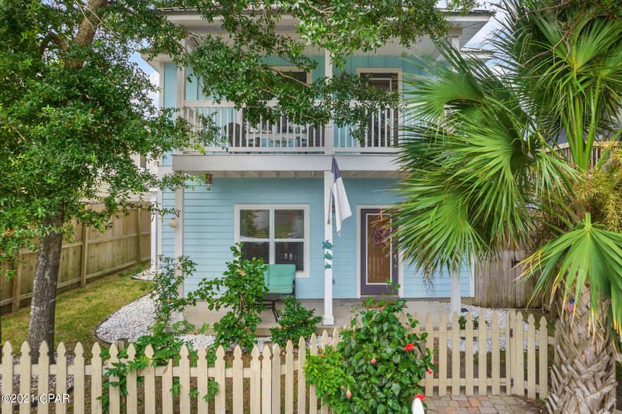 Charming two-story home on State Avenue with easy to maintain lot with mature palm trees and dreamy picket fence. Walk in to find beautiful open concept floor plan with hardwood floors, granite countertops, kitchen island, and stainless steel appliances. Large bedrooms throughout home!  Second story holds balcony with lush tropical tree views. First floor holds additional patio. Welcome Home.