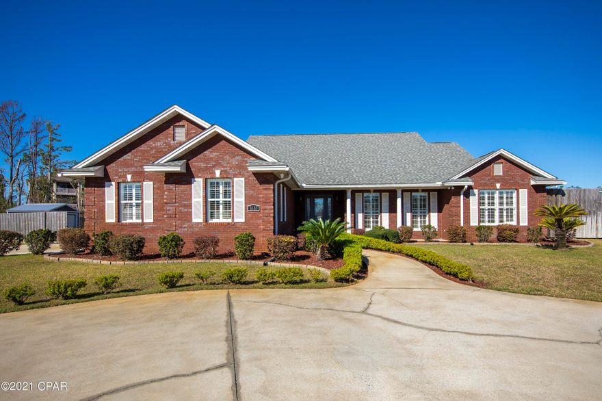 Magnificent and stately brick home located on a 1.05+/- acre lot with a fenced in backyard, new storage room and 40 ft. x 30 ft. pole barn.  This is a builders showcase home and has been constructed with supreme attention to detail.

This home features 12-inch crown molding in the main living areas, boardwalk style luxury vinyl plank (LVP) flooring in all living areas, premium tile flooring in the bathrooms, custom kitchen cabinetry, and plantation shutters.  The open floor plan concept of this home was designed with entertaining in mind and ample lighting graces every corner from an array of windows on the back of the home. The kitchen is a chef's dream with large custom cabinets, granite countertops, stainless steel appliances, double ovens and glass accents, and a large pantry.
As you enter the foyer of this home you are greeted with a informal dining room to your right, kitchen to your left, and the living room opens up to two french doors and a 29 ft. x 11 ft. screened porch.
A brand new Hot Springs hot tub was installed on the back screened in porch with 220 amp electric service.
A split bedroom plan was implemented in the design of this home for ultimate privacy.  The two guest bedrooms have large closets with overhead storage for extra bedding, linens, etc.
The master bedroom is massive spanning approximately 20 ft. x 15 ft. and opens into a bathroom with his and hers sinks and closets.
The exterior of this home is amazing with circular driveway, two 12 foot wide gates, private fenced in backyard, 30 ft. x 40 ft. pole barn in the backyard, private well (with surge tank) and septic tank, 12-zone irrigation system with 8 sprinkler heads per zone, a $5,000 Kinetico resin water filtration system, and a Trane heating and air conditioning system (installed in 2017).
The home has a large two car garage.