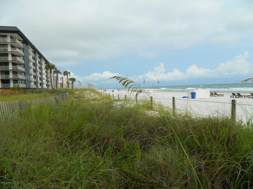 Immerse yourself in refreshing beachfront living! Imagine endless seascapes, breezes and sunsets! This condo sits right on the beach and is open and inviting with good sized rooms, galley kitchen. Recent updates. Fully furnished & rental ready so income can offset ownership expenses. Owner's Pets Welcome! Enjoy tropical pools, hot tubs, sun decks. Restaurant, room service, poolside bar, pizza shop, market. The Golf & Sports Club is just across the walkover offering unlimited golf, pro shop, gym, tennis, basketball, shuffleboard. Spa services available. Kids Adventure Club with splash pad, dive-in movies, activities calendar, special events. RV, Boat, Jet Ski parking. Onsite tram service. Gated entrances, Security. Walkable to shopping, dining, entertainment. On trolley line to Pier Park.