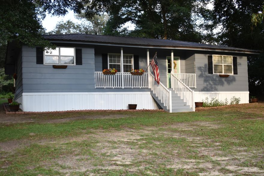 Beautifully renovated home in the country is just waiting for you to make it yours.  Many updates have been made to this home to include stainless appliances including a black stainless refrigerator with double ice maker,  granite countertops, undermount sink, wainscoting in dining room and baths, cedar planked walls in living room, new sheetrock, energy efficient windows and metal roof.   Spacious outbuilding is ideal for storage of your outdoor equipment, a covered parking area, and a 36 x 24 pole barn with an adjacent fish cleaning station makes the perfect spot to park your boat and clean your fish after a long day on the lake.