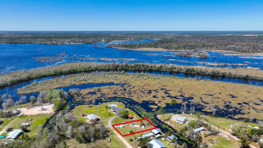 Waterfront Lot with Utilities! 

Build your dream home on this beautiful waterfront lot located on the canal of Deer Point Lake, a premier freshwater fishing destination known for its bass and bream. This vacant residential lot is ready for construction, complete with electric, well, and septic already in place—a rare find for a waterfront homesite!

Enjoy direct access to Deer Point Lake, which is fed by natural freshwater streams, including the pristine Econfina Creek. Whether you love boating, kayaking, or fishing right from your backyard, this property offers the perfect balance of outdoor adventure and peaceful lakefront living.

Conveniently located in Youngstown, FL, this lot offers a quiet retreat while still being a quick commute to Tyndall Air Force Base, Panama City, and Panama City Beach. Don't miss this opportunity to start building your waterfront oasis—schedule a visit today!