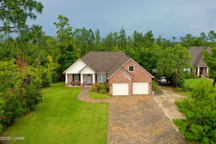 Meticulously Maintained and Move-in Ready, 1 owner All Brick Craftsman Style home located on an over 1/2 Acre Lot. This 3 bedroom 2 bath home also has a 12x15 Bonus Room with Full Bath above the garage that could be finished out to make a 4th bedroom Suite! The Interior has a Wow Factor from the time you walk into the front door with high ceilings & crown moldings. The Flooring is beautiful wood look tile in the main living areas & baths with carpeted bedrooms. The Kitchen features custom hardwood cabinetry, subway tile backsplash, Farmhouse Sink, Granite Countertops, big pantry & All Stainless Steel Appliances Convey! There is a breakfast nook & Formal Dining room. The spacious Living room has a tray ceiling & custom shiplap electric fireplace with elegant mantel. All the Lighting inside & out are custom upgraded light fixtures & fans. The Master suite is sophisticated & inviting with jewel toned accent wall & tray ceiling. There is a large walk in closet in the master bedroom & one in the master bath. The Master bath is amazing, it features a granite topped double vanity, Custom Tile Shower & Clawfoot Tub & closet! 2 Closets Total in the Master Suite! There is a large laundry room with storage cabinets & there is also a mud room with built in cubbies with benches & shiplap accents; this custom feature is sure to impress all who see it! The Additional bedrooms are spacious & the additional Full Bath has a granite topped vanity & tub/shower combo. The Bonus room & Full bath above the garage has so much potential if the new owner chooses to finish it out, the bathroom is fully plumbed for a toilet, sink & shower. The custom upgraded features don't stop when you head outside the home. The Exterior Features an oversized brick paver driveway, Large covered porches & an Extended Open Paver Patio & Paver Firepit. There is also a custom Turf Area which is the perfect place to relax in the hammock! The Home also has an Automatic Irrigation System, its located in Flood Zone X so no flood insurance is required by your lender & this subdivision has No $0 HOA Dues! This Home Won't Last Long! Call Today for Your Private Tour! ***All Measurements Approximate, Please Verify if Needed, Builders Plans Available for Viewing Upon Request***