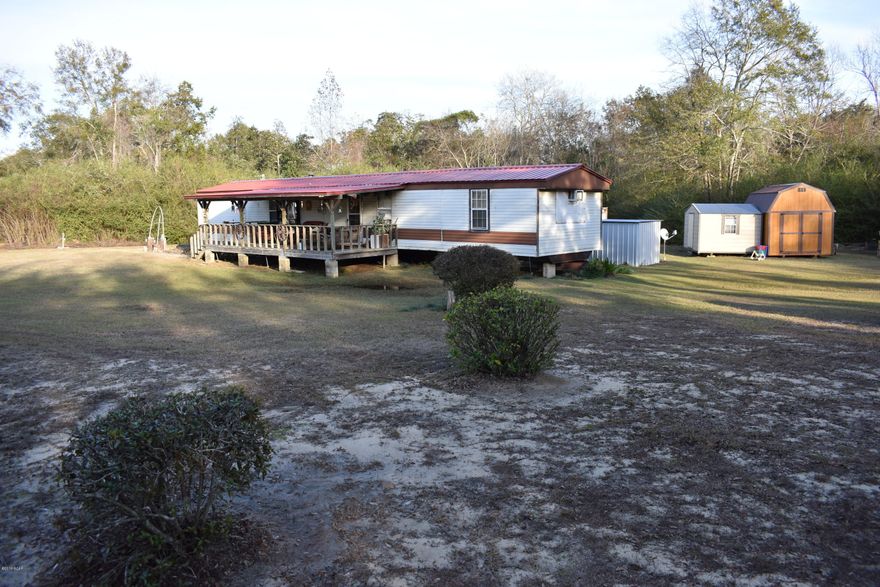 Don't miss your chance on this beautiful piece of property with 45 +/- acres!  Older mobile home is situated perfectly back off of the highway.  It has a front and back covered porch, new roof, stainless steel refrigerator and dishwasher like new condition, new septic tank installed, an above ground pool with a nice wood deck, outbuildings and a covered parking area. This is a deer hunters dream property, and it has a really nice cleared pathway leading through the wooded portion of the property.