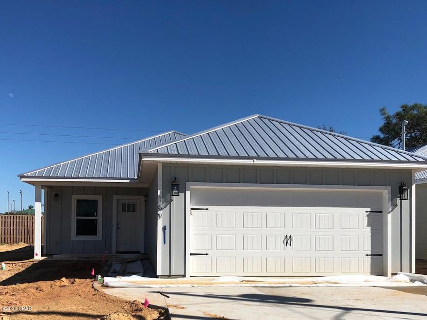 Great NEW CONSTRUCTION Craftsman Style home in GULF HIGHLANDS. This 4 bedroom features an OPEN FLOOR PLAN for maximum livability. The interior has hand scraped LVP flooring throughout , modern neutral paint colors, and stylish fixtures. A huge kitchen offers WHITE SHAKER CABINETS accented by QUARTZ counter tops and BLACK STAINLESS APPLIANCES.The split floor plan includes a spacious MASTER SUITE with walk in closet and BEAUTIFUL TILE SHOWER. The exterior has HARDIE BOARD SIDING, Metal Roof, LARGE PRIVACY FENCED YARD with landscaping and sprinkler system, and a 2 car garage. All this and just steps away from FRANK PARK and it's  great amenities. NO Required FLOOD INSURANCE and NO HOA's !